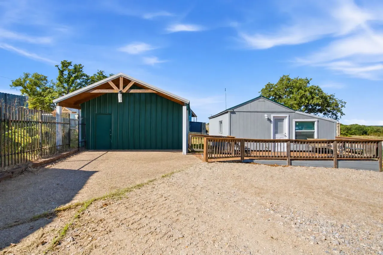 Front of the green shop with the cottage deck to the right