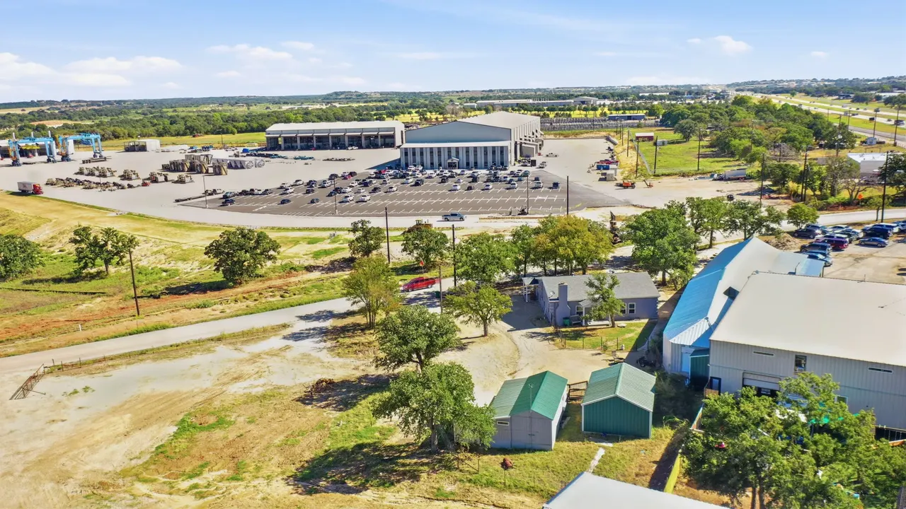 Aerial view of the outbuildings with a large warehouse next door