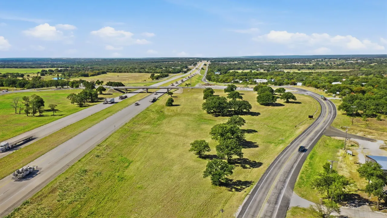 Aerial view of the frontage road curving beside the interstate